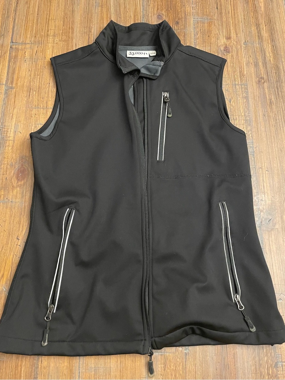 Women's Black Softshell Vest - Sleek Zip-Pocket Layer